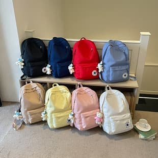 Classic five-pointed star logo backpack, simple solid color sports backpack, lightweight and water-resistant, suitable for middle and high school students