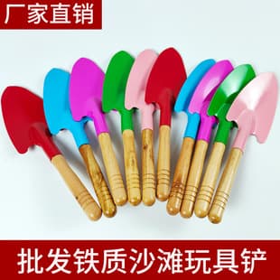 Kindergarten children play sand digging gardening tools beach driving sea planting flowers in the tree rake small shovel